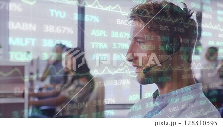 Image of interface showing data and statistics with man talking on phone in office 128310395