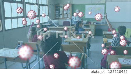 Multiple covid 19 cells floating against female teacher wearing face mask teaching at school Multiple covid 19 cells floating against female teacher wearing face mask teaching at school 128310485