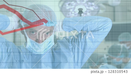 Financial data processing against caucasian male surgeon wearing face mask 128310543