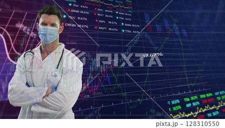 Portrait of caucasian male doctor wearing face mask against financial data processing Portrait of caucasian male doctor wearing face mask against financial data processing 128310550