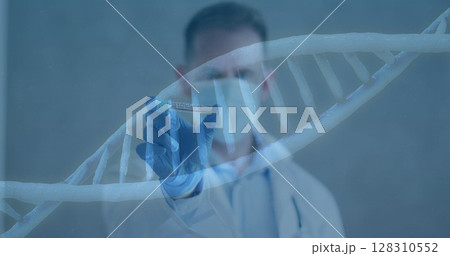 Dna structure spinning against male doctor wearing face mask holding covid 19 vaccine 128310552