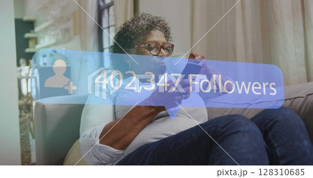 Image of speech bubble with followers text and numbers over senior woman using smartphone 128310685