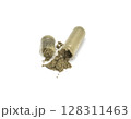 Expired herbal capsule powder on white background 128311463