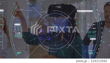 Data processing and scope scanning over woman wearing vr headset gesturing at office 128312082