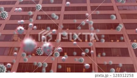 Image of covid 19 cells floating over office building on red background Image of covid 19 cells floating over office building on red background 128312258