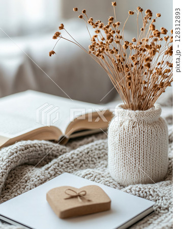 Key to tiny house of cozy home with Valentine decor. Warm and cozy house interior, place for relaxation. AI Generated. 128312893