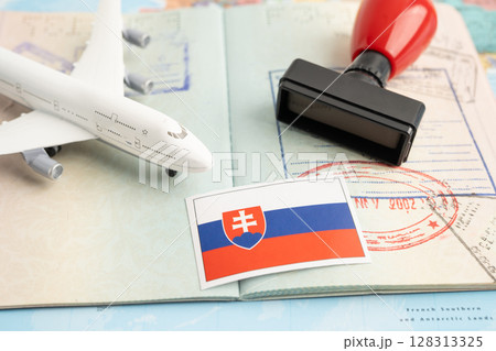 Slovakia flag and passport with airplane for travel. 128313325
