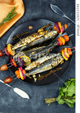 Fish and vegetable skewer in barbecue grill. Fish and vegetable skewer in barbecue grill. 128313748