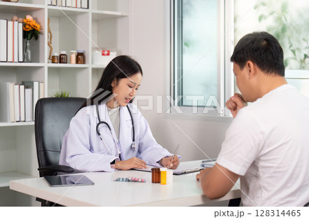 Healthcare. Doctor consulting patient about treatment plan. 128314465