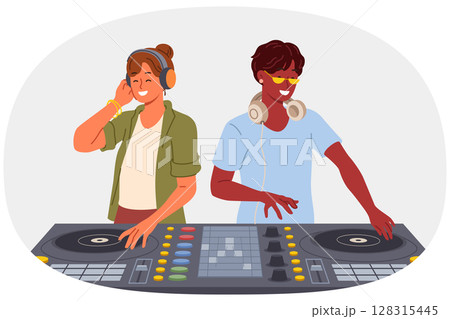 Two DJ use mixing console to entertain visitors to disco in nightclub and play original musical hits 128315445