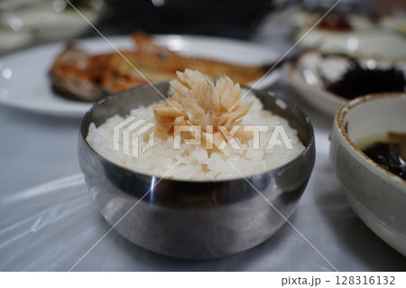 Grilled Fish on Steamed White Rice. Traditional Korean Meal Presentation Grilled Fish on Steamed White Rice. Traditional Korean Meal Presentation 128316132