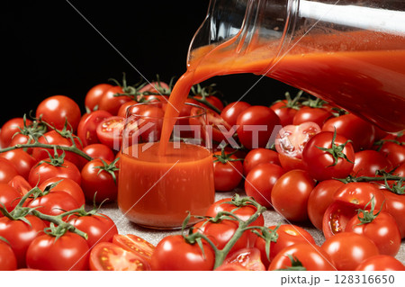 Natural Organic Tomato Juice Poured Into Glass, Farm Tomatoes. 128316650