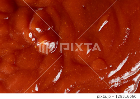 Macro texture of ketchup, natural traditional tomato sauce, top view, culinary background. 128316660