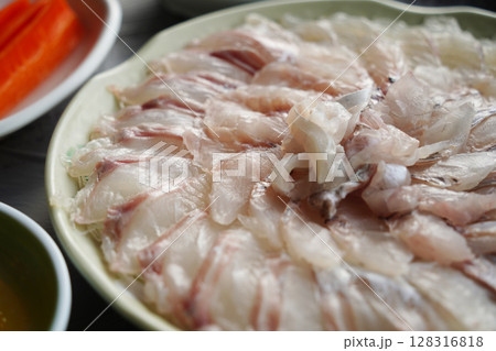 Freshly Sliced Korean Sashimi Platter. Raw Fish Served on a Plate Freshly Sliced Korean Sashimi Platter. Raw Fish Served on a Plate 128316818