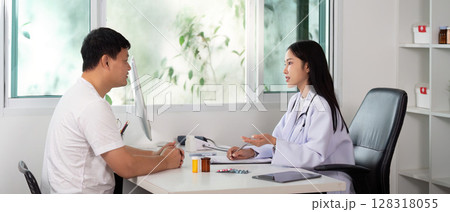 Healthcare Consultation. Doctor discussing treatment options with male patient in modern clinic. 128318055