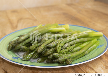 Fresh Steamed Green Asparagus on Plate  128318067