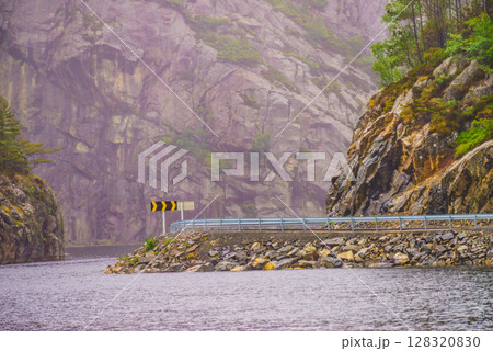 Road and fjord landscape in Norway 128320830