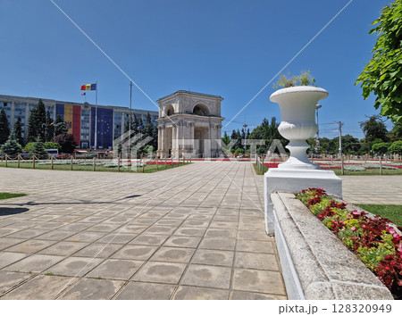 CHISINAU, MOLDOVA - JUNE 20, 2025 Triumphal Arch as popular historical landmark of the capital with the Moldovan Government House in the background CHISINAU, MOLDOVA - JUNE 20, 2025 Triumphal Arch as popular historical landmark of the capital with the Moldovan Government House in the background 128320949