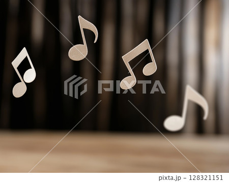 Music notes creating a melody with rhythm and harmony on a wooden background Music notes creating a melody with rhythm and harmony on a wooden background 128321151