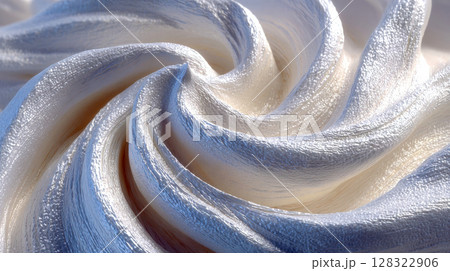 Textured white and cream abstract swirls resembling thick paint or sculpted frosting in soft lighting 128322906