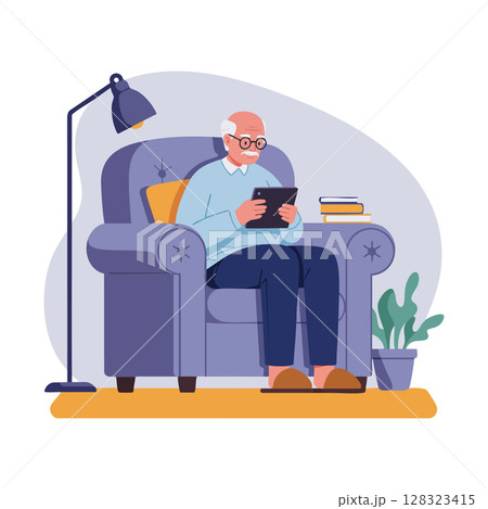 Elderly man sitting comfortably in armchair reading tablet at home lifestyle scene 128323415