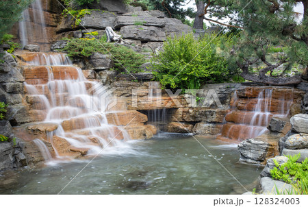 Beautiful waterfall in the China Garden in Montreal. 128324003