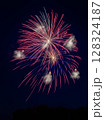Colourful fireworks exploding in the night sky. 128324187