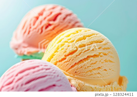 Three scoops of assorted ice cream flavors on a blue backdrop. AI-generated content. 128324411