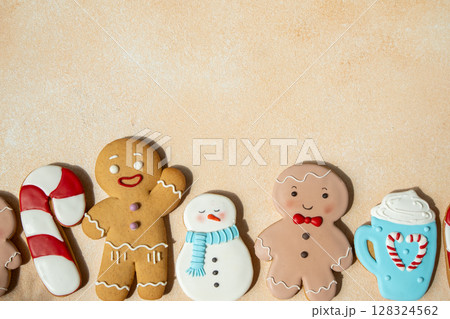Gingerbread cookies with icing decoration. Christmas food. Gingerbread man baking gift. Top view table. Xmas sweet copy space background Gingerbread cookies with icing decoration. Christmas food. Gingerbread man baking gift. Top view table. Xmas sweet copy space background 128324562