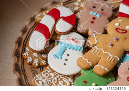 Gingerbread cookies with icing. Christmas food. Gingerbread man baking. Top view table 128324566
