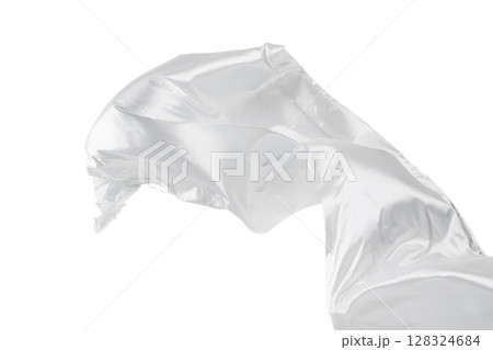 Flowing white fabric flying on white background. 128324684