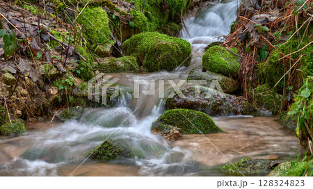 Majestic Allerheiligen Waterfalls: Serene Long Exposure Cascade in Black Forest National Park Germany. Scenic Forest Stream Flows Through Lush Greenery and Moss Covered Rocks Creating Ethereal 128324823
