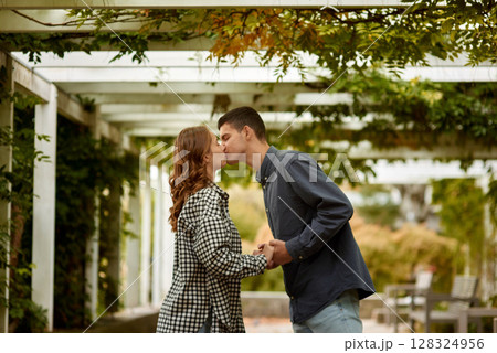 Young Cute Female Hugs Boyfriend. In Autumn Outdoor. Lovers Walking in Park. Attractive Funny Couple. Lovestory in Forest. Man and Woman. Cute Lovers in the Park. Family Concept. Happy Couple. 128324956