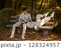 Young Cute Female Hugs Boyfriend. In Autumn Outdoor. Lovers Walking in Park. Attractive Funny Couple. Lovestory in Forest. Man and Woman. Cute Lovers in the Park. Family Concept. Happy Couple. 128324957