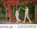 Young Cute Female Hugs Boyfriend. In Autumn Outdoor. Lovers Walking in Park. Attractive Funny Couple. Lovestory in Forest. Man and Woman. Cute Lovers in the Park. Family Concept. Happy Couple. 128324958