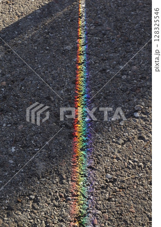 Rainbow is reflected in the pavement 128325546