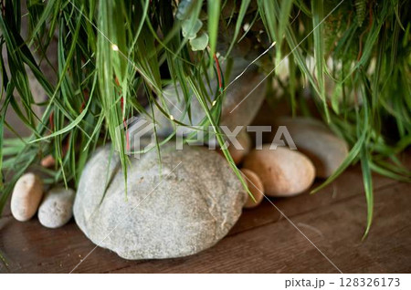 Large stones in the d cor on the open veranda, terrace board. Outdoor design 128326173