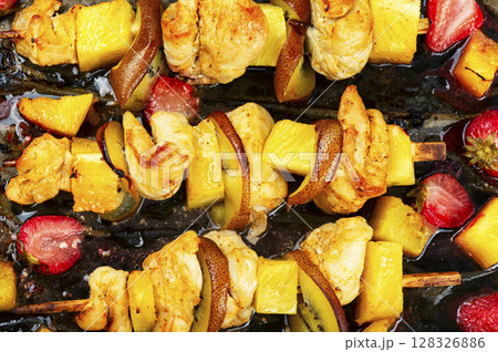 Grilled chicken on bamboo skewers. Grilled chicken on bamboo skewers. 128326886