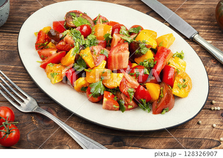 Delicious vegetable salad with fresh tomatoes. 128326907