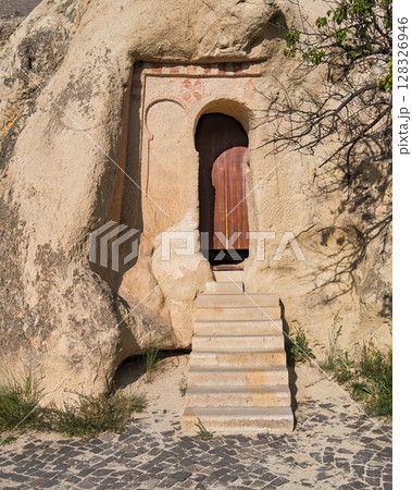 Ancient Rock-Cut Dwelling Entrance with Steps and Painted Details, Cappadocia, Turkey 128326946