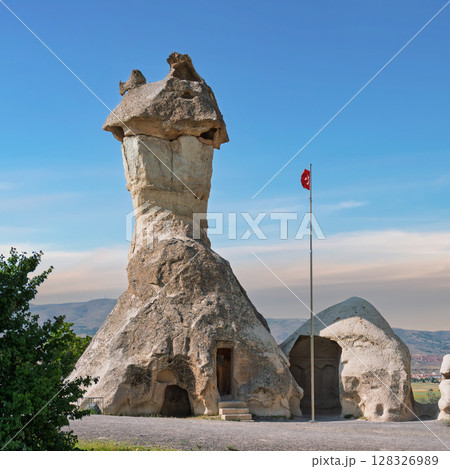 Iconic Fairy Chimney rock formation in Pasabag Valley, aka Monks Valley, Cappadocia, Turkey 128326989
