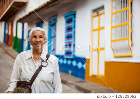 Senior woman at the beautiful colonial town of Concepcion located in the department of Antioquia in Colombia. 128329062