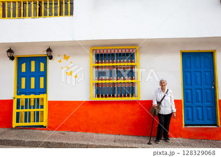 Senior woman at the beautiful colonial town of Concepcion located in the department of Antioquia in Colombia. 128329068