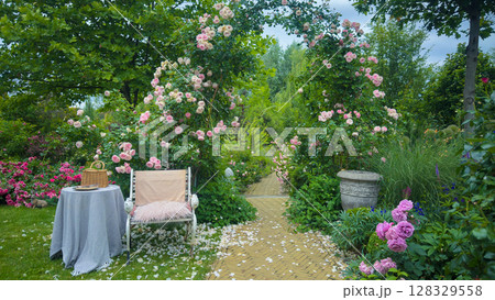 Serene Garden Pathway Surrounded by Lush Flowers and Blooming Roses, Perfect for Relaxation and Outdoor Escapes in Nature's Beauty. Serene Garden Pathway Surrounded by Lush Flowers and Blooming Roses, Perfect for Relaxation and Outdoor Escapes in Nature's Beauty. 128329558