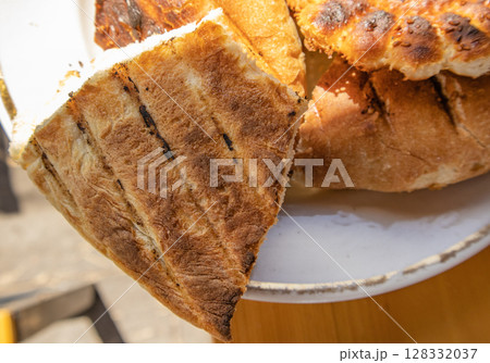Bits of delicious toasted flatbread on a plate, top view, Asian oriental cuisine 128332037
