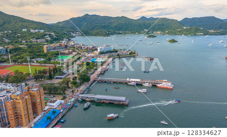 July 5 2025 Scenic Coastal Town by the Harbor with Boats and Hills 128334627
