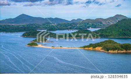 July 5 2025 Scenic View of Green Islands in a Beautiful Blue Sea by Mountains July 5 2025 Scenic View of Green Islands in a Beautiful Blue Sea by Mountains 128334635