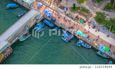 July 5 2025 Scenic Coastal Town by the Harbor with Boats and Hills 128334644