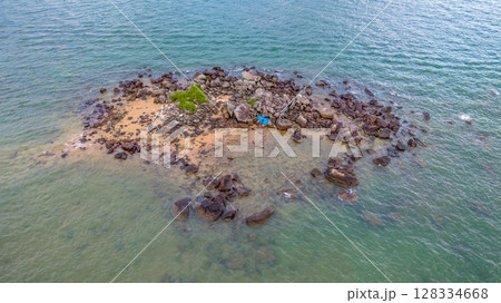 July 5 2025 Coastal Beach with Clear Water and Rock Formations in Natural Setting 128334668