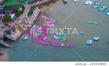 July 5 2025 Colorful Kayaks Docked Near a Waterfront in Vibrant Setting 128334680